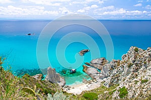 Aerial panoramic view of horizon and amazing tropical blue azure turquoise water of sea, rock cliff grass hill, yacht boat, blue