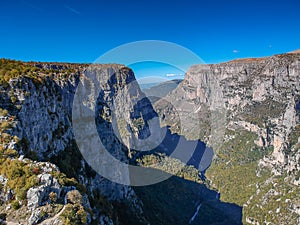 Aerial panoramic view of the impressive Vikos gorge in the Zagoria region at Pindus Mountains of northern Greece. It lies on the