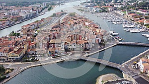 Aerial panoramic view of landscape of old town of Martigues on Mediterranean coast with scenic canals and marina on