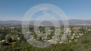 Aerial panoramic view of large city on sunny day. Residential urban neighbourhood. Los Angeles, California, USA