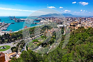 Aerial panoramic view of Malaga city, Andalusia, Spain in a beautiful summer day with the town hall the port and the sea