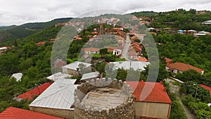 Aerial panoramic view of medieval fortress and houses in Sighnaghi town, Georgia