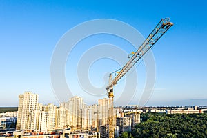 Aerial panoramic view of new apartment building under construction on blue sky background