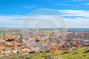 Aerial panoramic view over the orange tile roofs to a small span