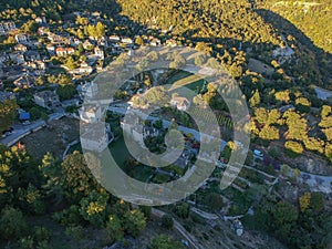 Aerial panoramic view over the picturesque village Papigo in Epirus, Greece at sunset. Scenic aerial view of traditional Greek