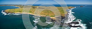 Aerial panoramic view of Phillip Island coastline near The Nobbies Centre and Round Island, Australia