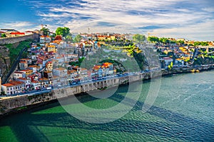 Aerial panoramic view of Porto Oporto city with colorful buildings and traditional houses on steep slope