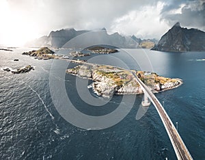 Aerial panoramic view of Reine traditional fishing village in the Lofoten archipelago in northen Norway with blue sea