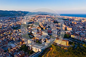 Aerial view of Sant Adria de Besos and Badalona with sea and mountains in background photo