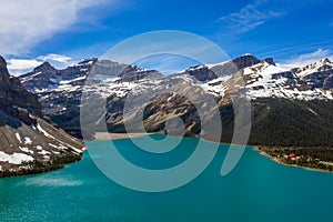 Aerial panoramic view of the scenic Bow Lake with a reflection of the mountains on the Icefields Parkway in Banff National Park