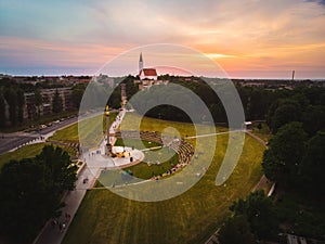 Aerial panoramic view of Siauliai city panorama in summer with beautiful sunset and people