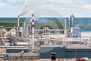 aerial panoramic view on smoke of pipes of chemical or wooden enterprise plant. Industrial landscape environmental pollution waste