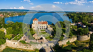 Aerial panoramic view of the Tata Castle, in Hungary with the Ãâreg TÃÂ³ Old Lake in the background photo
