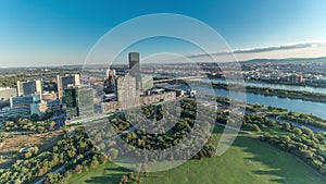 Aerial panoramic view of Vienna city with skyscrapers, historic buildings and a riverside promenade timelapse in Austria