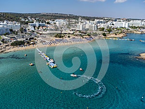 Aerial panoramic view on holidays resorts and blue crystal clear water on Mediterranean sea near Fig Tree beach, Protaras, Cyprus