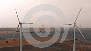 Aerial panoramic view of wind turbines and farmlands in Spain