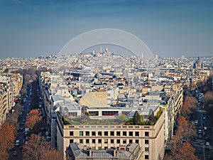 Aerial Paris cityscape with view to Sacre Coeur Basilica of the Sacred Heart, France. Beautiful parisian architecture with