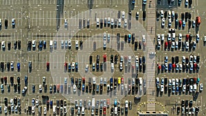 Aerial. Parking lot with hundreds of cars.