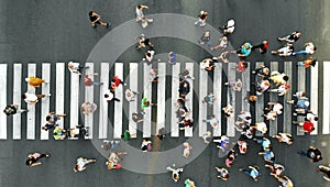 Aerial. People crowd. Many people going through the pedestrian crosswalk. photo