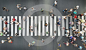 Aerial. People crowd motion on pedestrian crosswalk. Top view photo