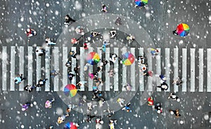 Aerial. People crowd on a pedestrian crossing crosswalk