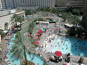 Aerial of People play and hangout at Vegas Hotel Pool Party