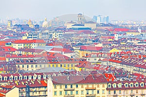Aerial view of Turin city with red roofs and attics photo