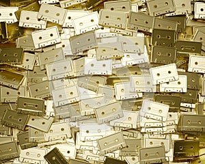 Aerial Perspective on a Layered Field of Unlabelled Gold Music Cassettes