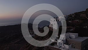 Aerial perspective of Little Village on Milos Island, Greece after Sunset with Ocean View
