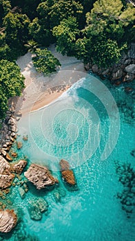 An aerial perspective of a sandy beach stretching along the coast, meeting a vast body of water