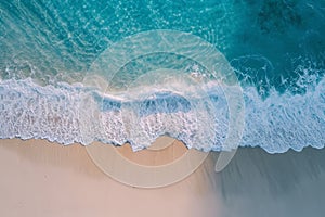 An aerial perspective of a sandy beach and the vast expanse of the ocean