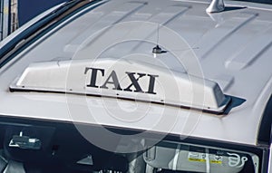 An aerial perspective of a white taxi sign