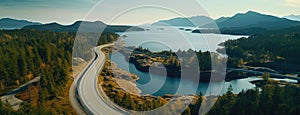 Aerial perspective of a winding section of the Sea to Sky Highway, showcasing the road's integration with the