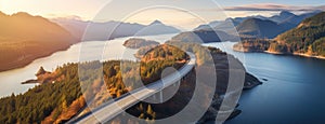 Aerial perspective of a winding section of the Sea to Sky Highway, showcasing the road's integration with the