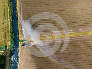 Aerial photo of agricultural land being irrigated during dry period summer