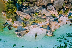 Aerial photo of beautiful famous paradise tropical beach Anse Source D Argent at La Digue island, Seychelles. Summer