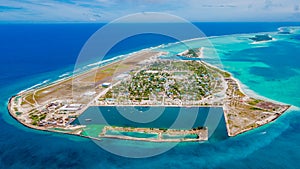 Aerial photo of the beautiful tropical island Maamigili at Alif Dhaal Atoll at the indian ocean