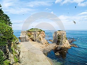 Aerial photo of cape Ptichiy near by cape Velikan, Sakhalin island, Russia Sahalin. Surrealistic landscape, natural arches.