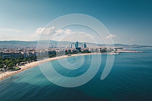 This aerial photo captures a beach and a city, showcasing the beautiful coastal landscape and urban development, Daytime aerial