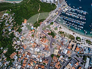 Aerial photo city, ocean and mountains. View from the top to streets of Arraial do Cabo Brazilian state of Rio de