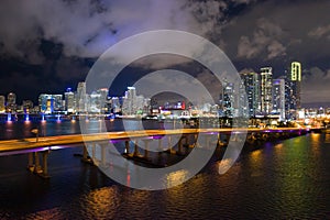 Aerial photo Downtown Miami at night. Bridges over water leading to the city