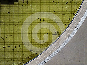 Aerial photo of the edge of an abandoned swimming pool, climate change concept