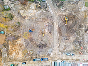 Aerial photo of an excavator and bulldozers working on a construction sit