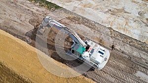 Aerial photo of an excavator on a construction site