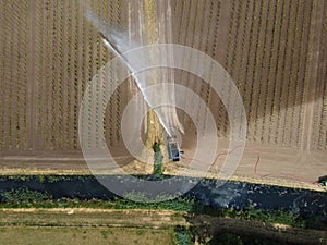 Aerial photo of a field being irrigated in a dry period in the Betuwe, Netherlands