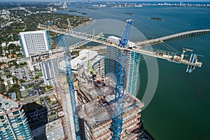 Highrise architecture under construction with cranes aerial image