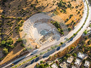 Aerial photo of historical places, theater ruins, massive ancient theatre of Halicarnassus, Bodrum, Turkey with highway