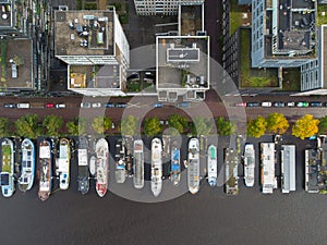 Aerial photo of houseboats and buildings in Amsterdam