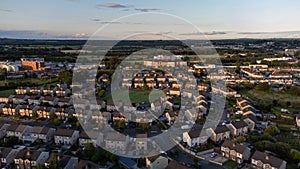 Aerial photo of housing estate in the Summer showing the tops of houses