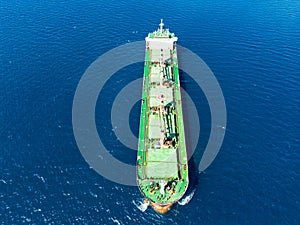Aerial photo of huge bulk carrier tanker anchored in deep blue Aegean sea
